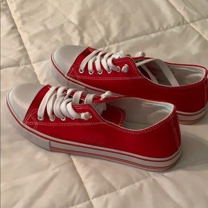 Lightly worn red tennis shoes